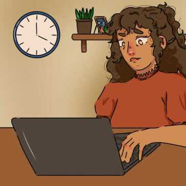 A woman sitting using her laptop.