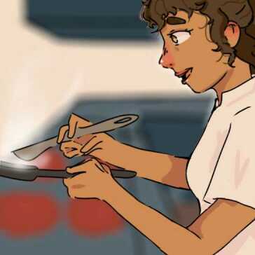 A woman cooking in a restaurant.