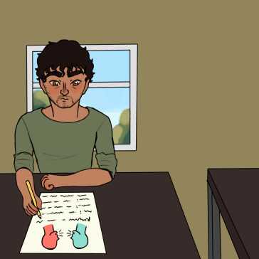 A man sitting at a desk studying.