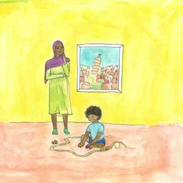 A woman standing and a young boy playing on the floor.